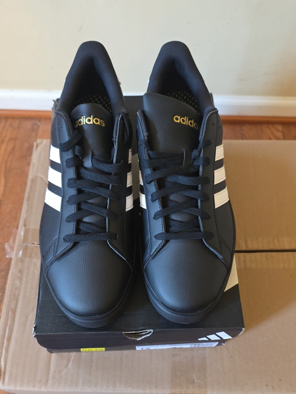 adidas Black Sneakers with White Stripes and Gold Logo